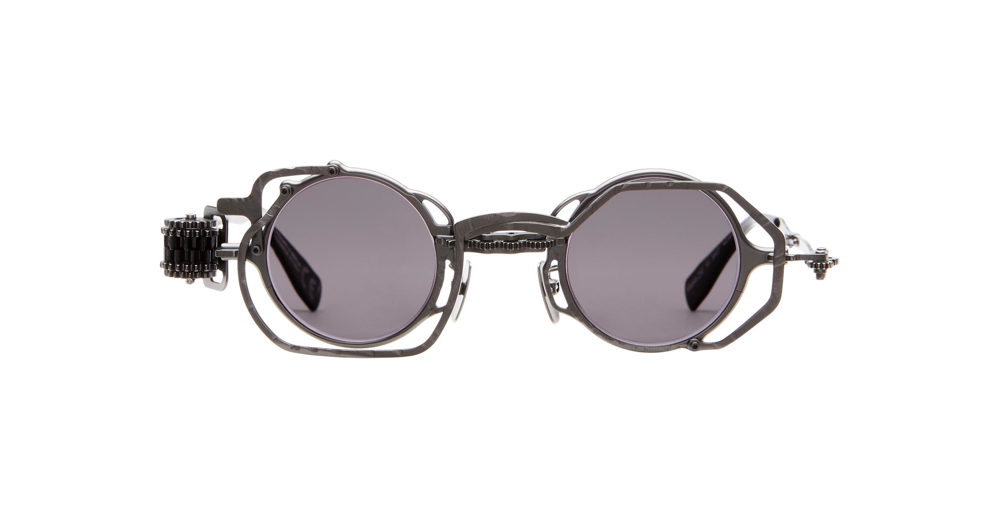 Kuboraum Z50 sunglasses by KUBORAUM, shown from the front, feature round geometric frames, gray lenses, and metal sides.