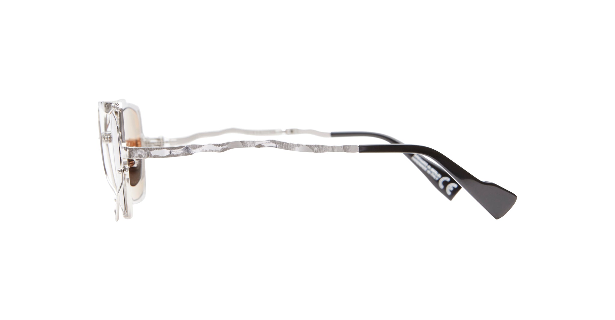 Side view of KUBORAUM Z51 eyeglasses with clear wavy acetate arms and black temple tips. Brand and model visible.