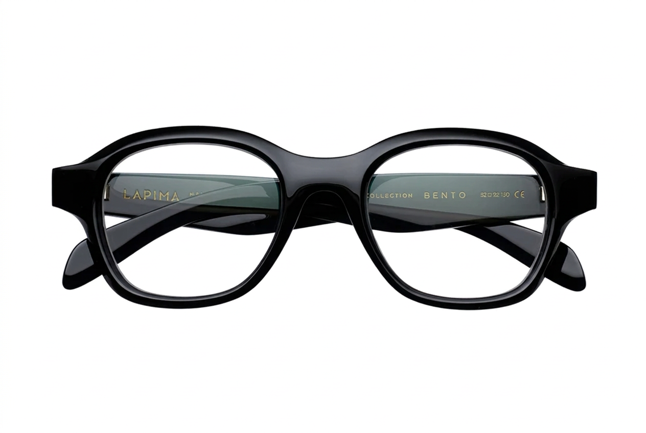 Front view of Lapima Bento optical glasses in black acetate, featuring a bold rounded rectangular frame, sculpted bridge, and clear lenses.