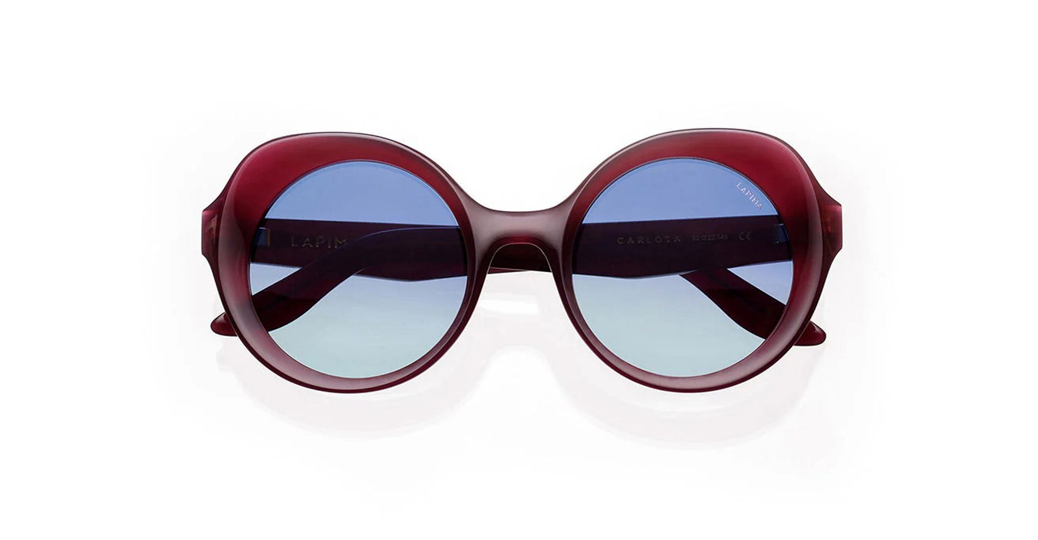 Round sunglasses with a thick, dark red frame and blue-tinted lenses, displayed against a plain white background.