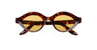 A pair of tortoiseshell sunglasses with round, yellow-tinted lenses, viewed from the front against a white background. The brand name Lapima is visible on the inside of the left arm.