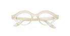 The Lapima Isa features translucent ivory eyeglasses with thick, rounded frames and oval lenses, showcased front-facing against a white background.