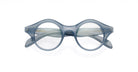 Lapima Marta eyeglasses in round, blue translucent acetate with a thick frame, shown from the front on a white background.