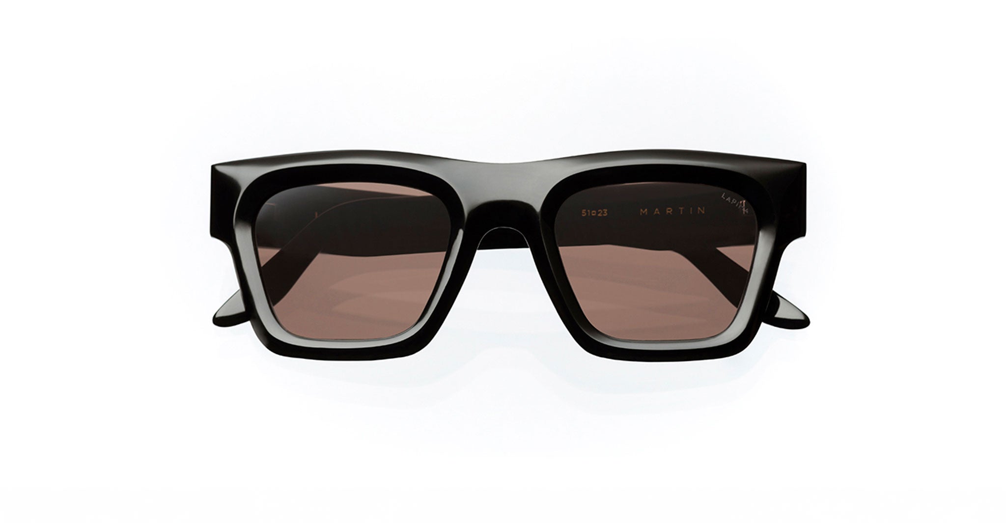 The Lapima Martin is a pair of black, rectangular sunglasses handcrafted in Brazil from premium Italian acetate, featuring thick frames and brown-tinted lenses, shown against a plain white background.