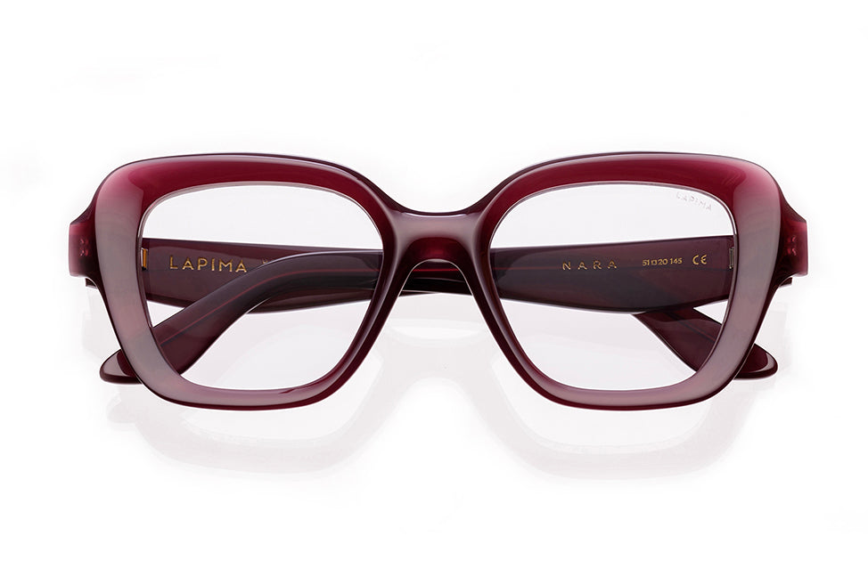 A pair of square, thick-framed eyeglasses in a deep burgundy color, viewed from the front. The inside of the left temple arm is printed with the brand name Lapima.