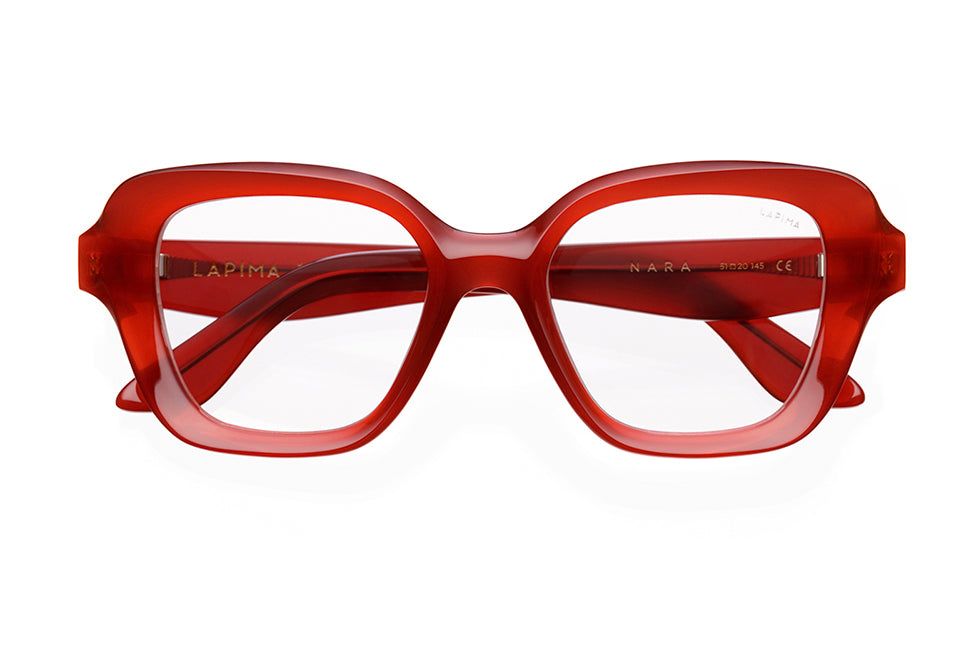 A pair of red, rectangular eyeglasses with thick frames. The brand LAPIMA and model NARA are visible on the inside of the temples. The lenses are clear and the arms are also made of thick red material.
