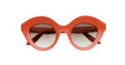 Front view of Lapima Nina sunglasses featuring round, bold matte red frames, brown-tinted lenses, a wide bridge, and the Lapima brand name visible on the left lens.
