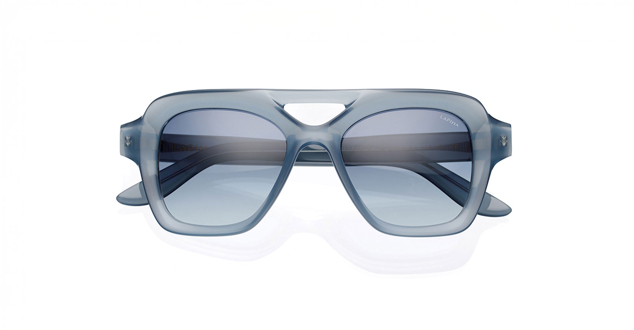 Lapima Samuel sunglasses by Lapima, blue transparent thick-frame design with tinted lenses, shown from the front.