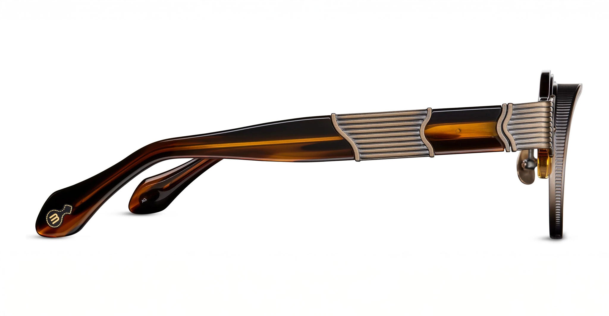 Side view of Matsuda 10605H eyeglasses featuring tortoiseshell-patterned arms and ribbed metallic accents on the temples, displayed against a white background.