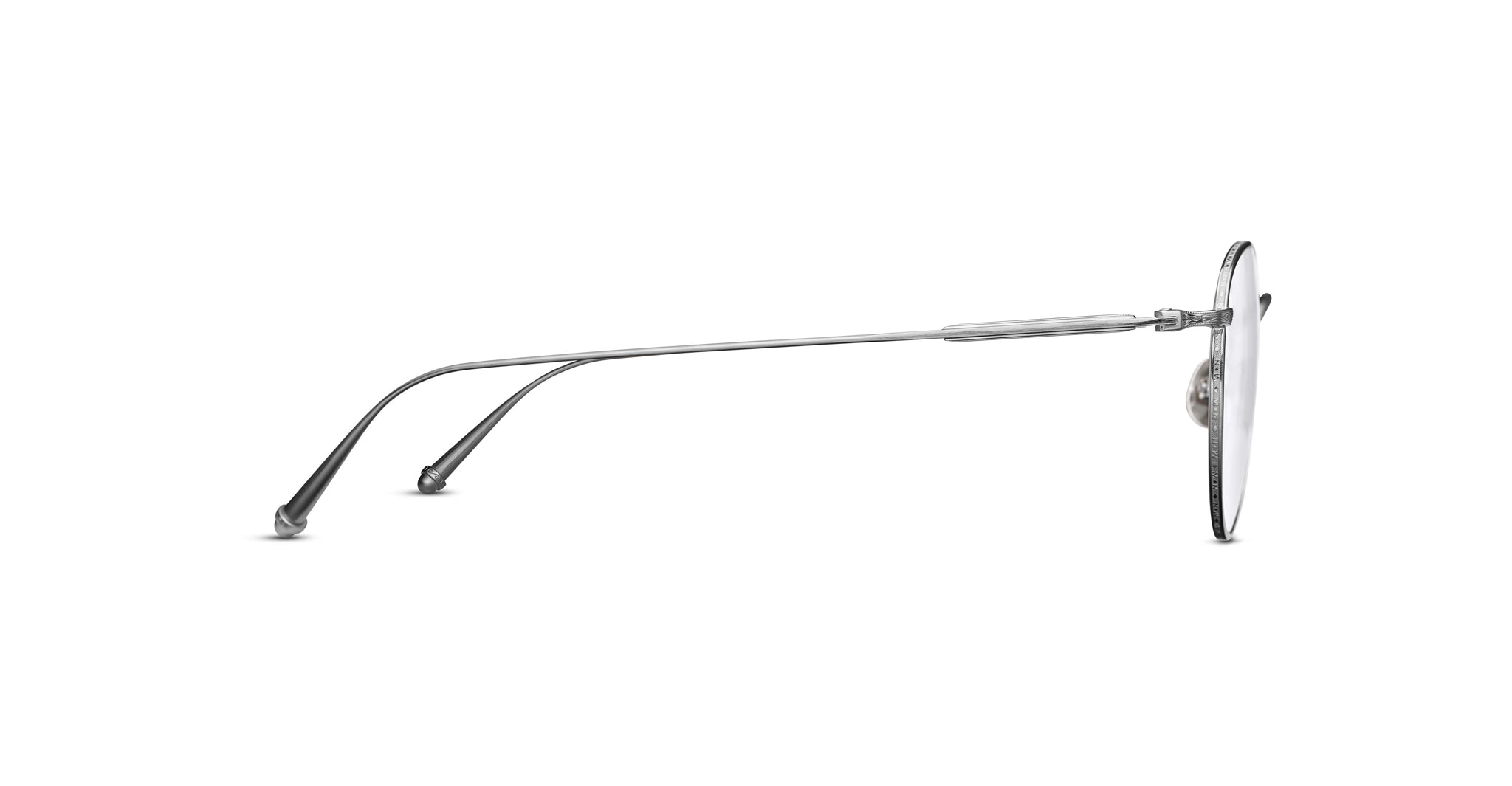 Matsuda M3085 optical frame in brushed silver, featuring a minimalist round rimless design with finely engraved metal rims, slim titanium temples, and sculpted temple tips with signature detailing.