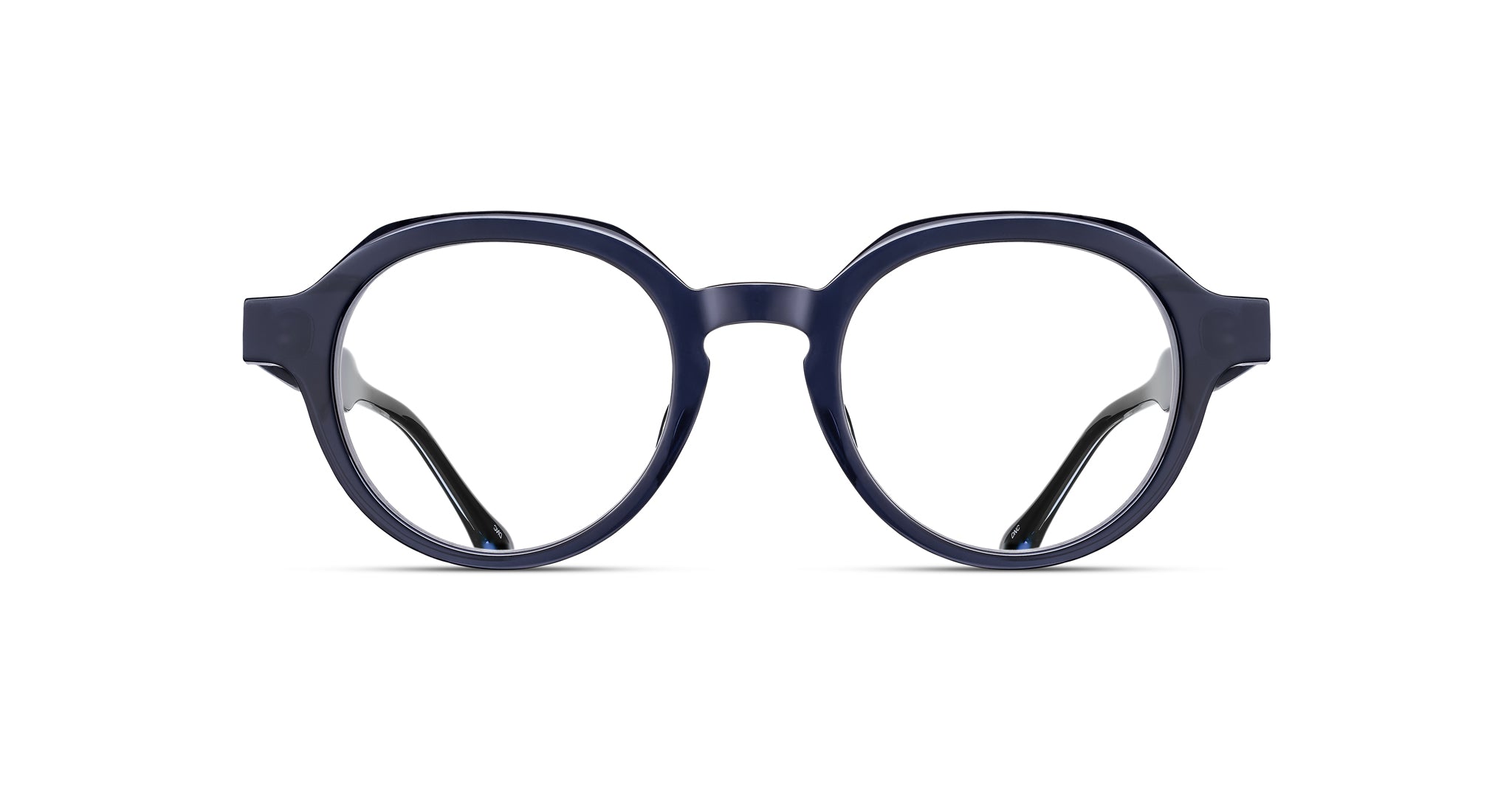 The Matsuda M1032 features thick-framed, round eyeglasses in dark blue, shown from the front on a white background.