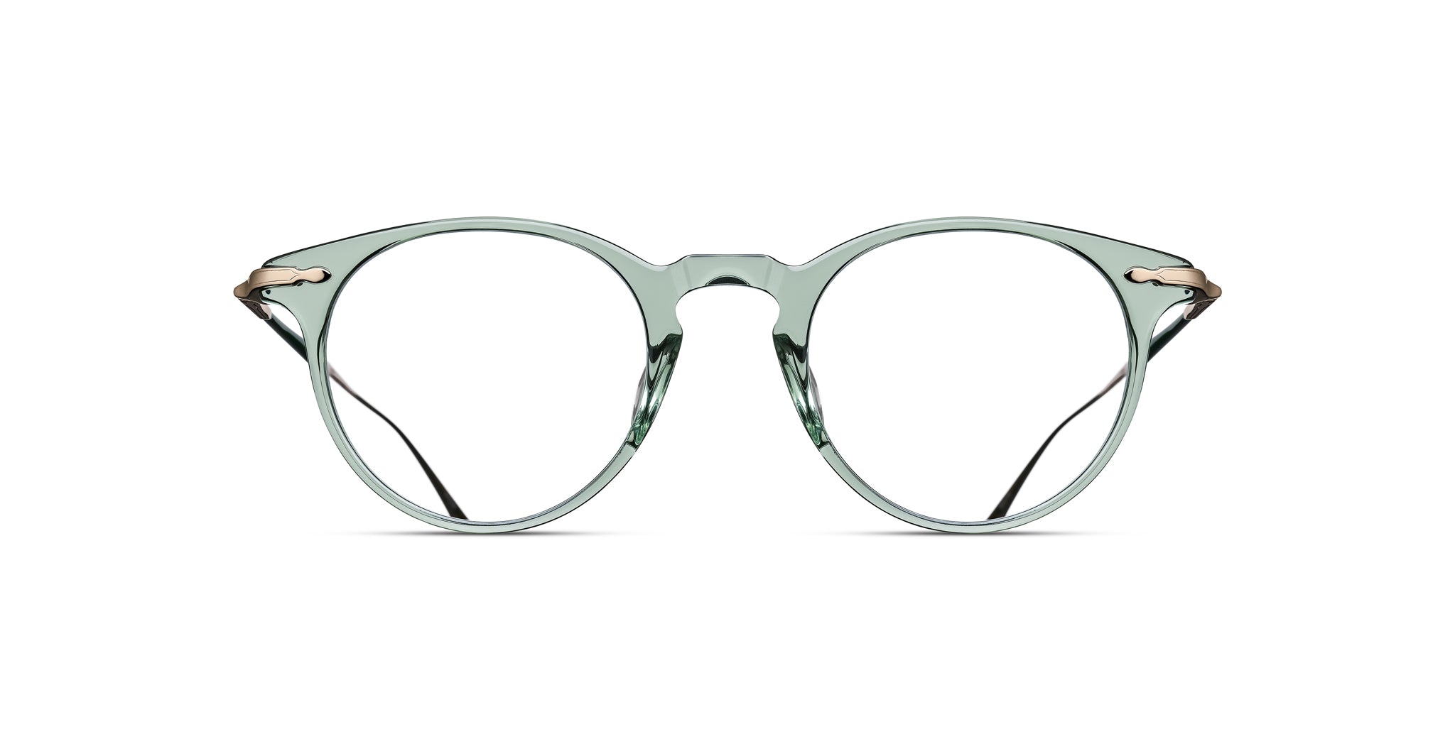 Matsuda M2056 eyeglasses feature clear round frames, a keyhole bridge, and metal hinges, shown from the front angle.