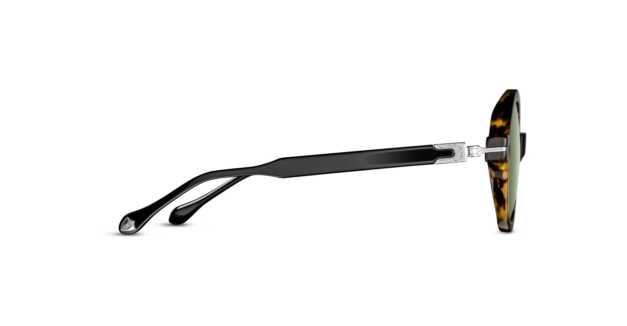 Side view of Matsuda M2059 sunglasses featuring a tortoiseshell frame, green-tinted lenses, and black curved arms with metal hinge detailing.