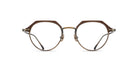 The Matsuda M2064 eyeglasses feature round lenses, thin metal frames, and a unique brown upper rim, displayed facing forward on a white background.