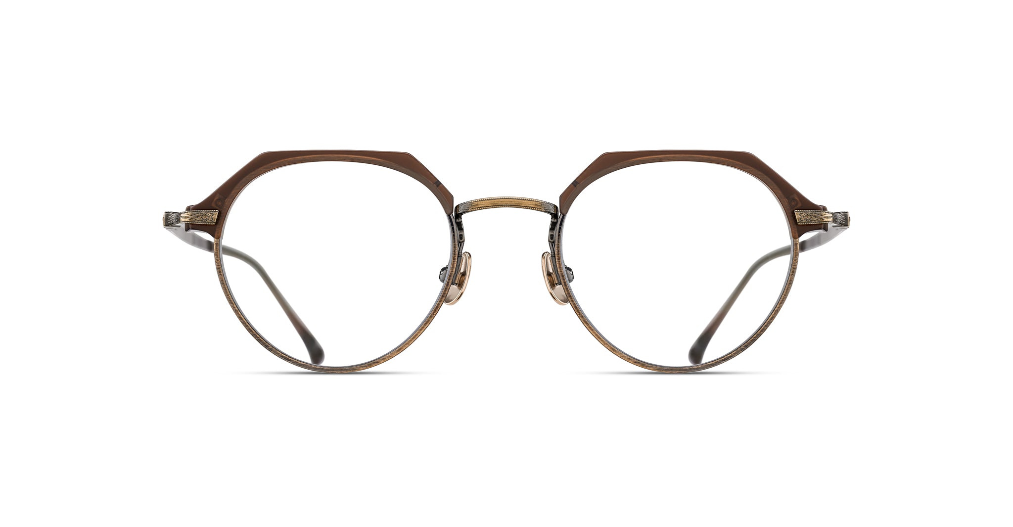 The Matsuda M2064 eyeglasses feature round lenses, thin metal frames, and a unique brown upper rim, displayed facing forward on a white background.