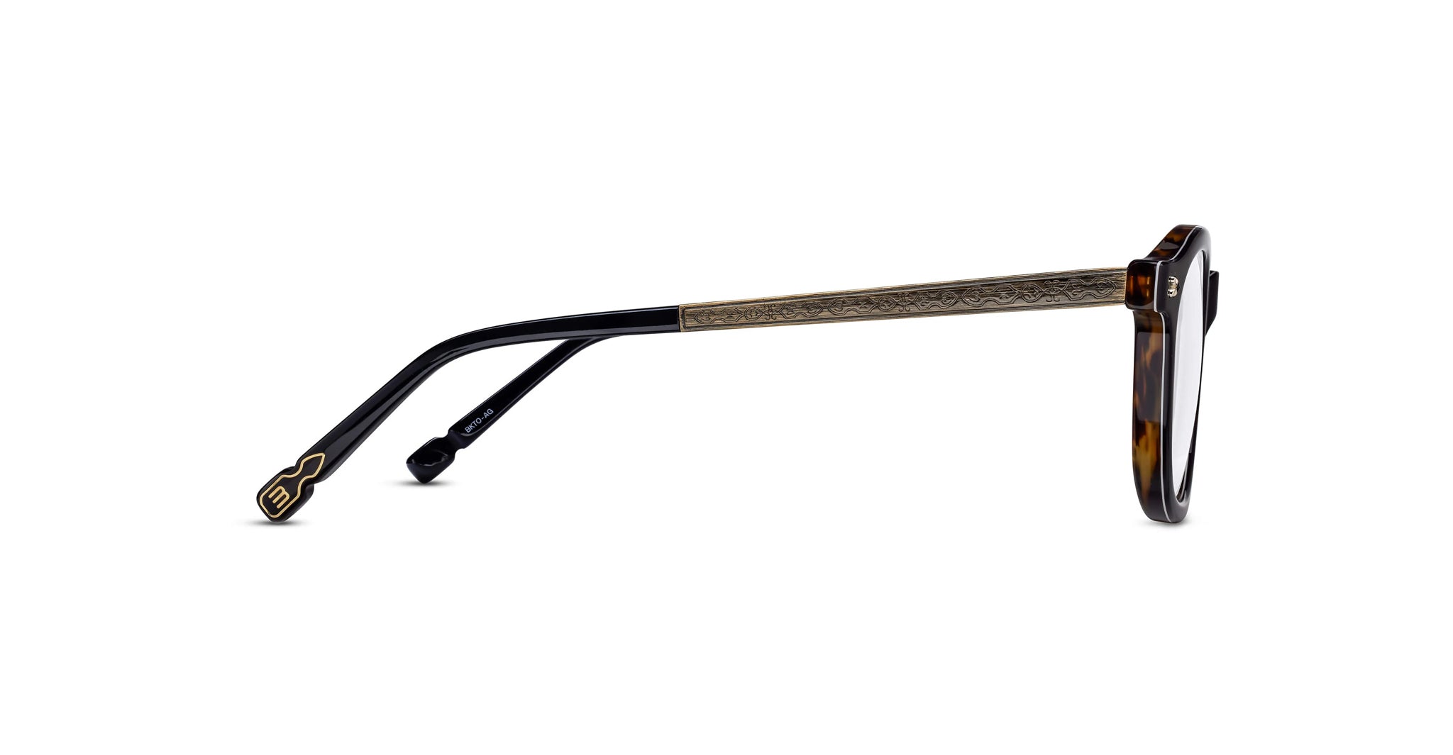 Side view of Matsuda M2068 eyeglasses featuring a tortoiseshell frame, engraved metal temples, and black and gold key-shaped tips. The clear lenses complement the modern, stylish design.
