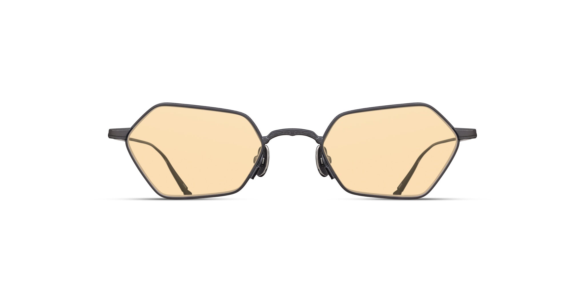 Matsuda M3138 eyeglasses by Matsuda with thin black hexagonal frames and light yellow photochromic lenses, front view.