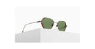 The Matsuda M3153 sunglasses, featuring green lenses and a metal frame, are displayed on a white rectangular pedestal against a plain white background.