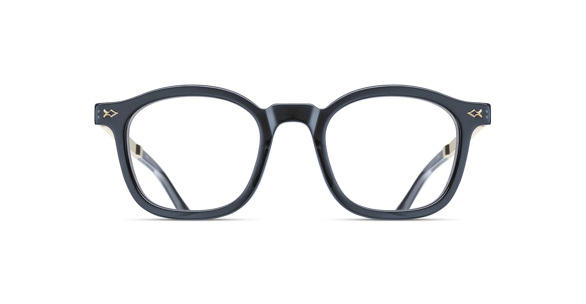 Front view of Matsuda M2068 black round eyeglasses with thick frames and clear lenses, featuring small decorative metal accents at the upper corners, set against a white background.