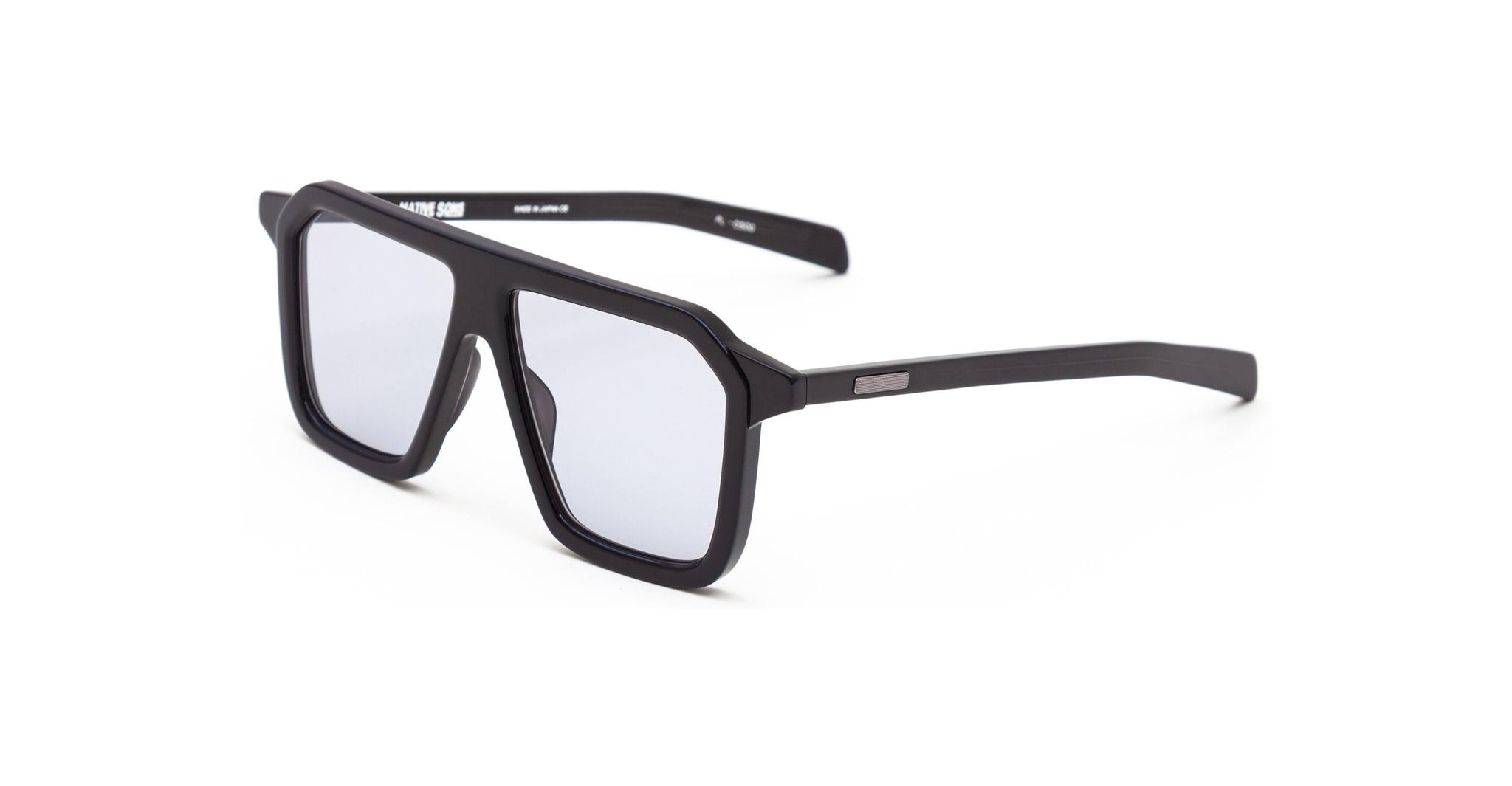 The Native Sons Revelator sunglasses feature black, rectangular frames with thick edges and lightly tinted lenses, displayed at an angle on a white background.