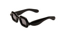 Paloceras Pebble SX double black sunglasses with glossy black frame and dark gray tinted lenses shown at an angle