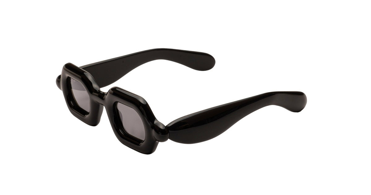Paloceras Pebble SX double black sunglasses with glossy black frame and dark gray tinted lenses shown at an angle