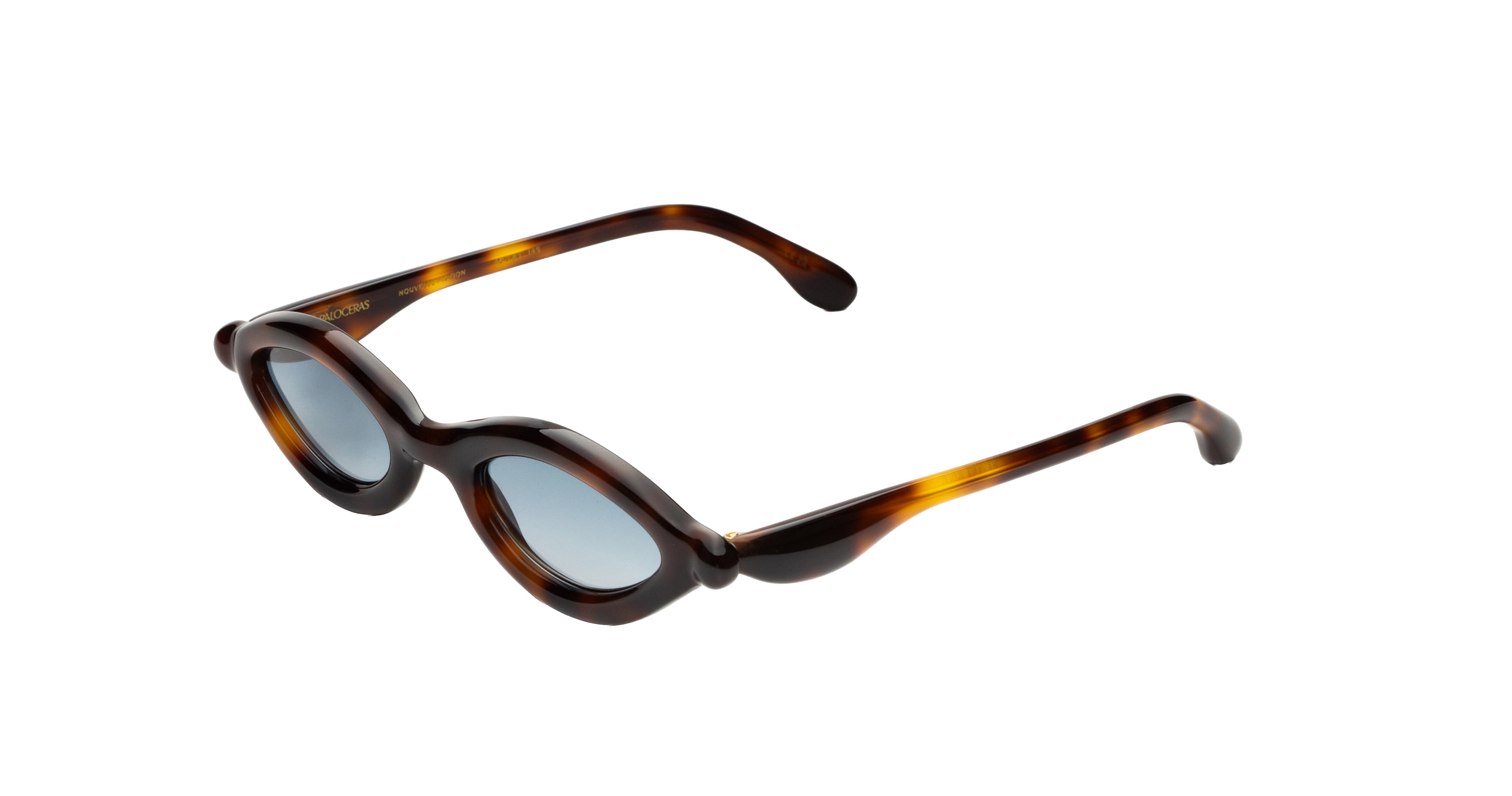 Paloceras D2 cateye sunglasses in Havana Gold, a dark tortoise frame with warm amber highlights and blue-gray lenses, angled view