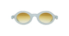 Paloceras Nouvelle Fiction R2 Milky Blue sunglasses in a pale translucent blue frame with thick rounded oval rims and warm golden gradient lenses, front view