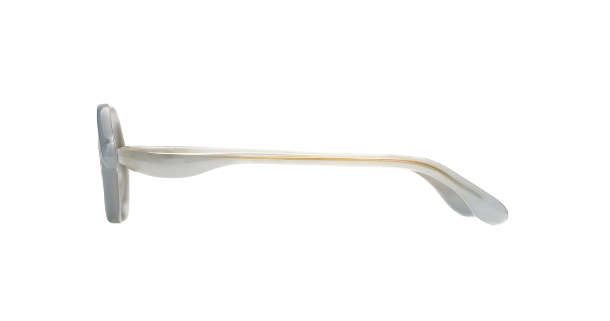 Paloceras Nouvelle Fiction R2 Milky Blue sunglasses in a pale translucent blue frame with thick rounded oval rims and warm golden gradient lenses, three-quarter view
