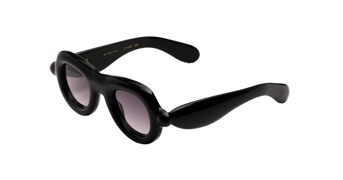 Paloceras black Pebble VX oversized aviator sunglasses with a thick, sculptural frame and gradient gray lenses, shown at an angle