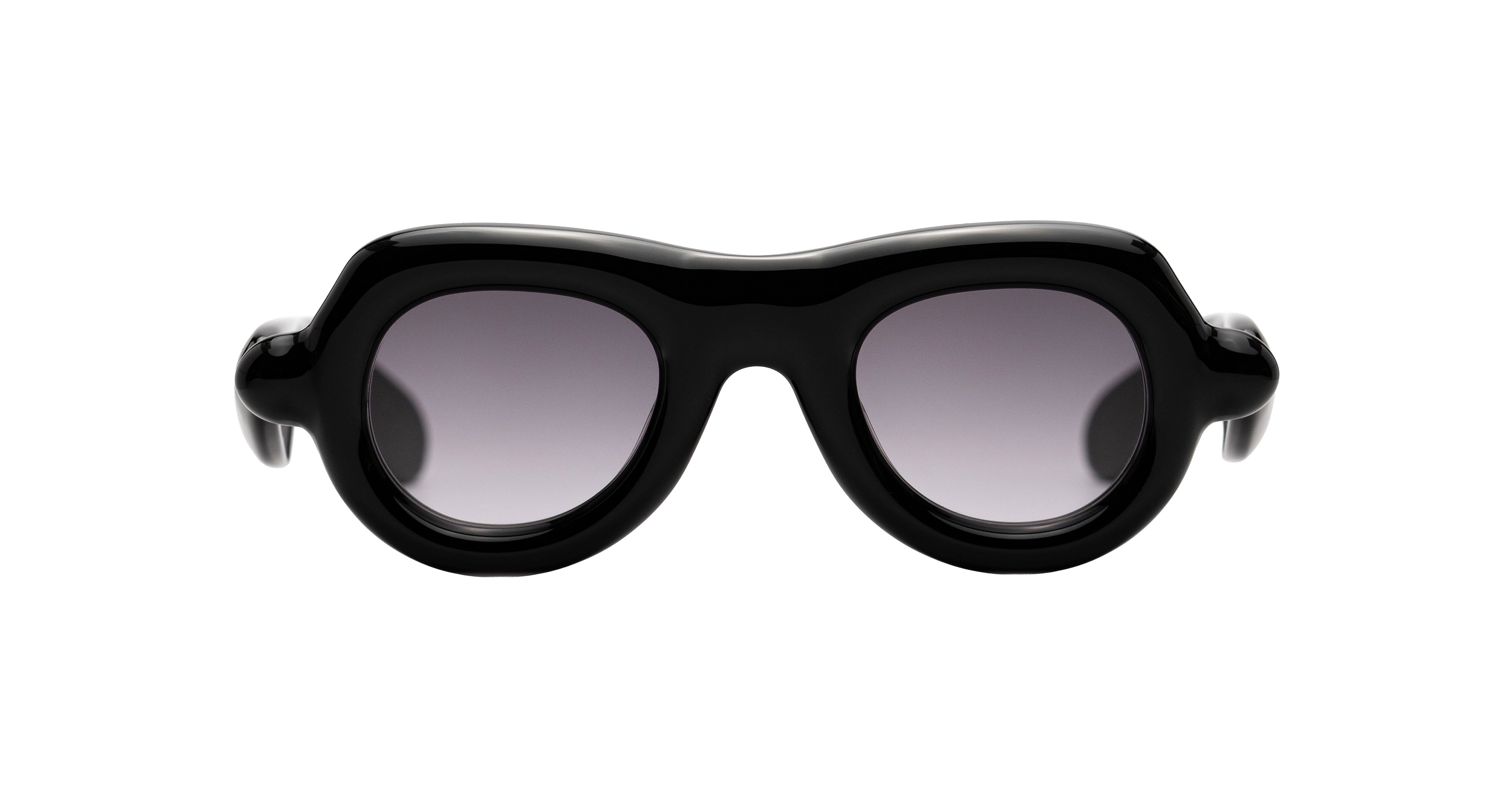 Black oversized aviator sunglasses with a thick, sculptural frame and gradient gray lenses by Paloceras