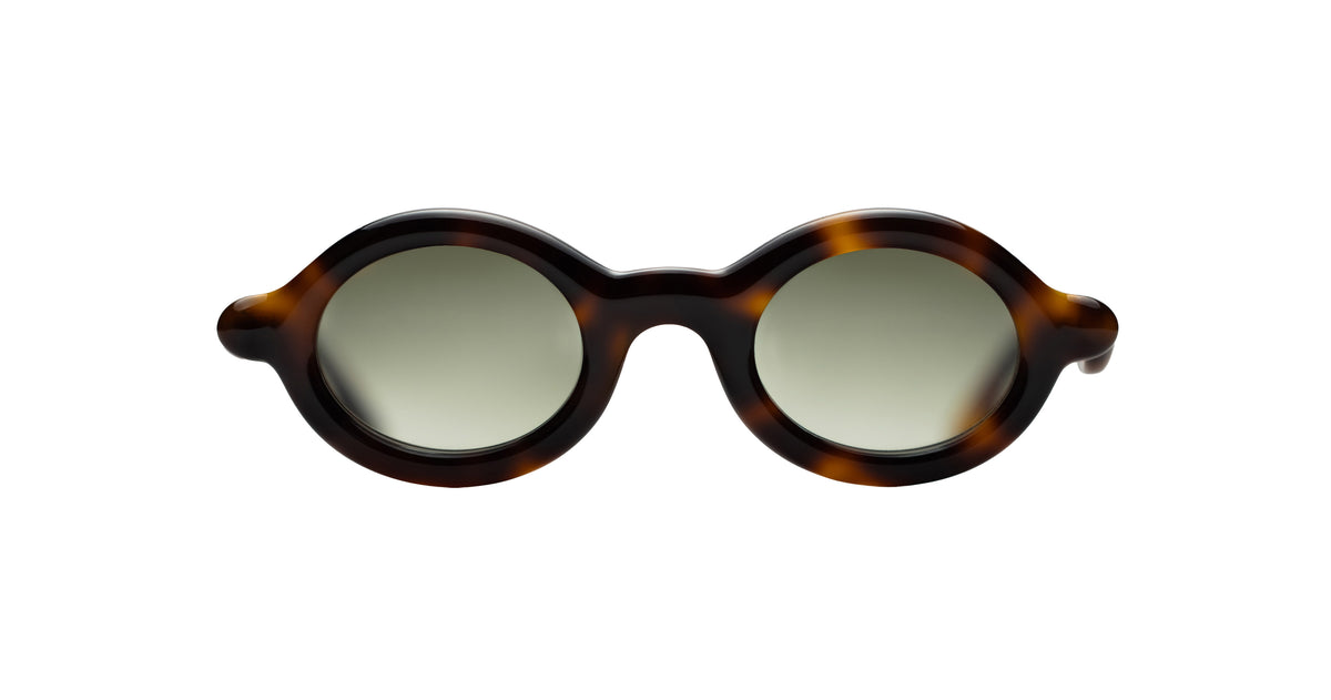 Paloceras Nouvelle Fiction R2 Havana Gold sunglasses in a dark brown tortoiseshell frame with warm amber highlights, rounded oval rims, and pale green lenses, front view