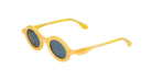 Paloceras Nouvelle Fiction R2 Melon Dust sunglasses in a warm translucent golden yellow frame with thick rounded oval rims and dark blue lenses, three-quarter view