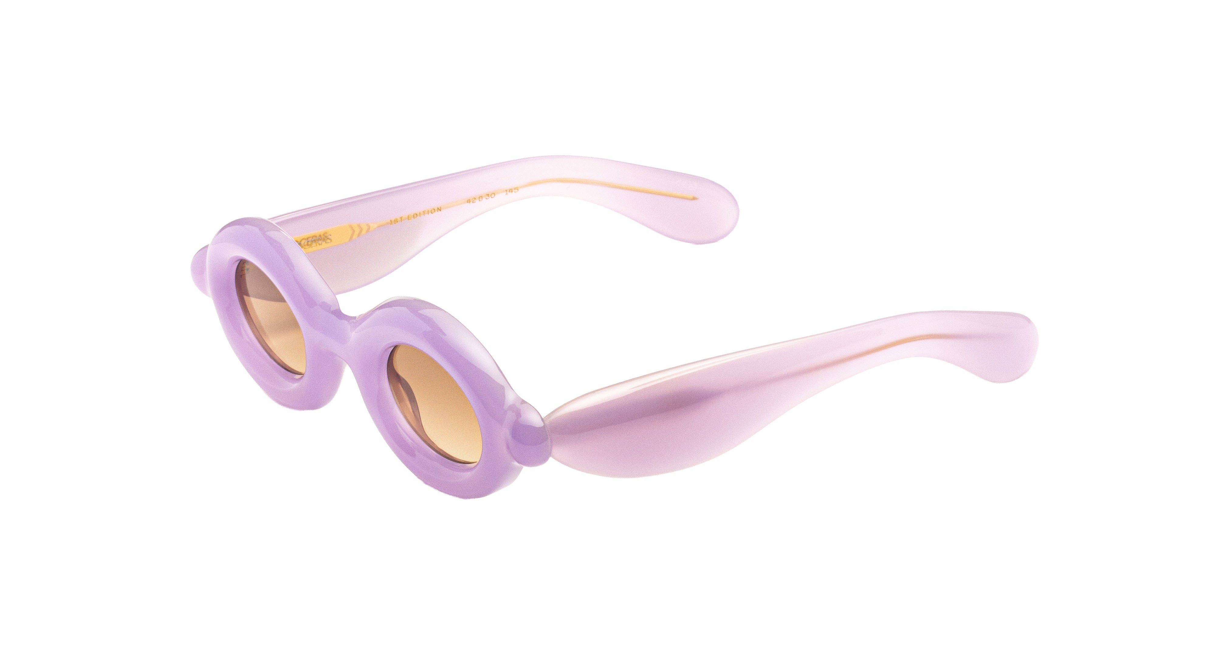 Paloceras Pebble RX Lilac Dream sunglasses with thick rounded rims and warm brown lenses, angled view