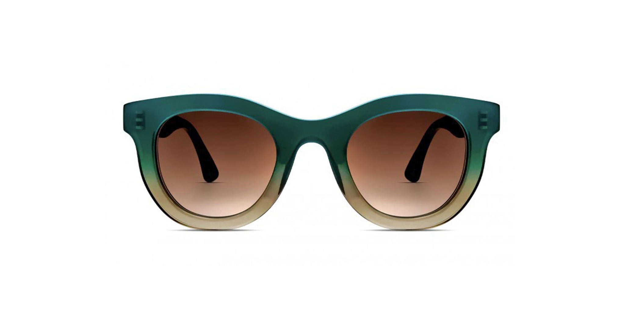 The Thierry Lasry Consistency sunglasses feature round frames with a thick green-to-beige gradient and brown-tinted lenses, displayed front-facing on a white background.