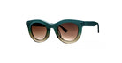 The Thierry Lasry Consistency features oversized, round green frames and brown gradient lenses, displayed from the front against a plain white background.