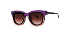A pair of stylish sunglasses with thick, cat-eye frames that fade from purple at the top to pinkish-orange at the bottom, and dark gradient lenses.