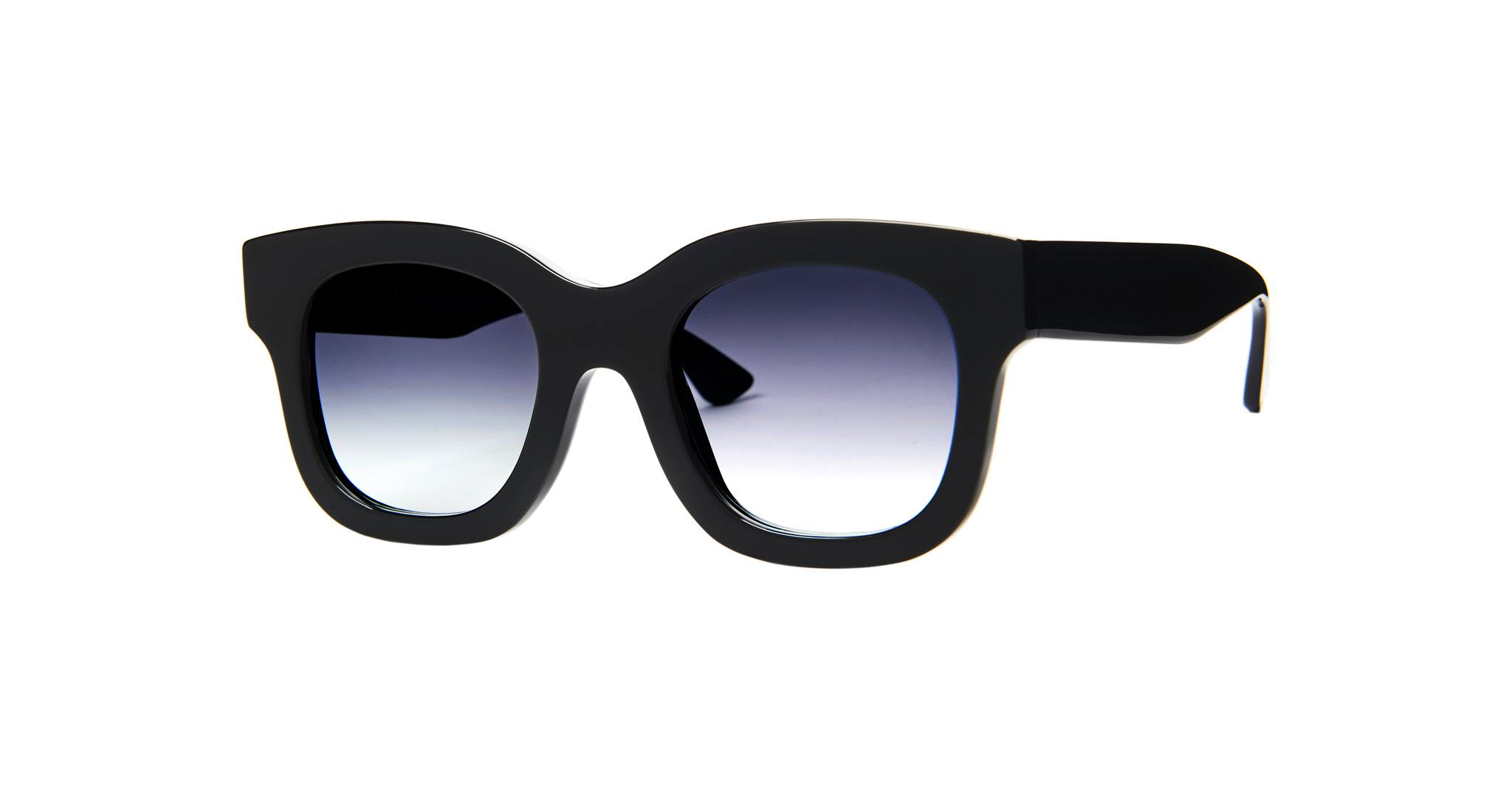 The Thierry Lasry Unicorny features black, thick frames with square lenses and a dark gradient tint, displayed on a white background.