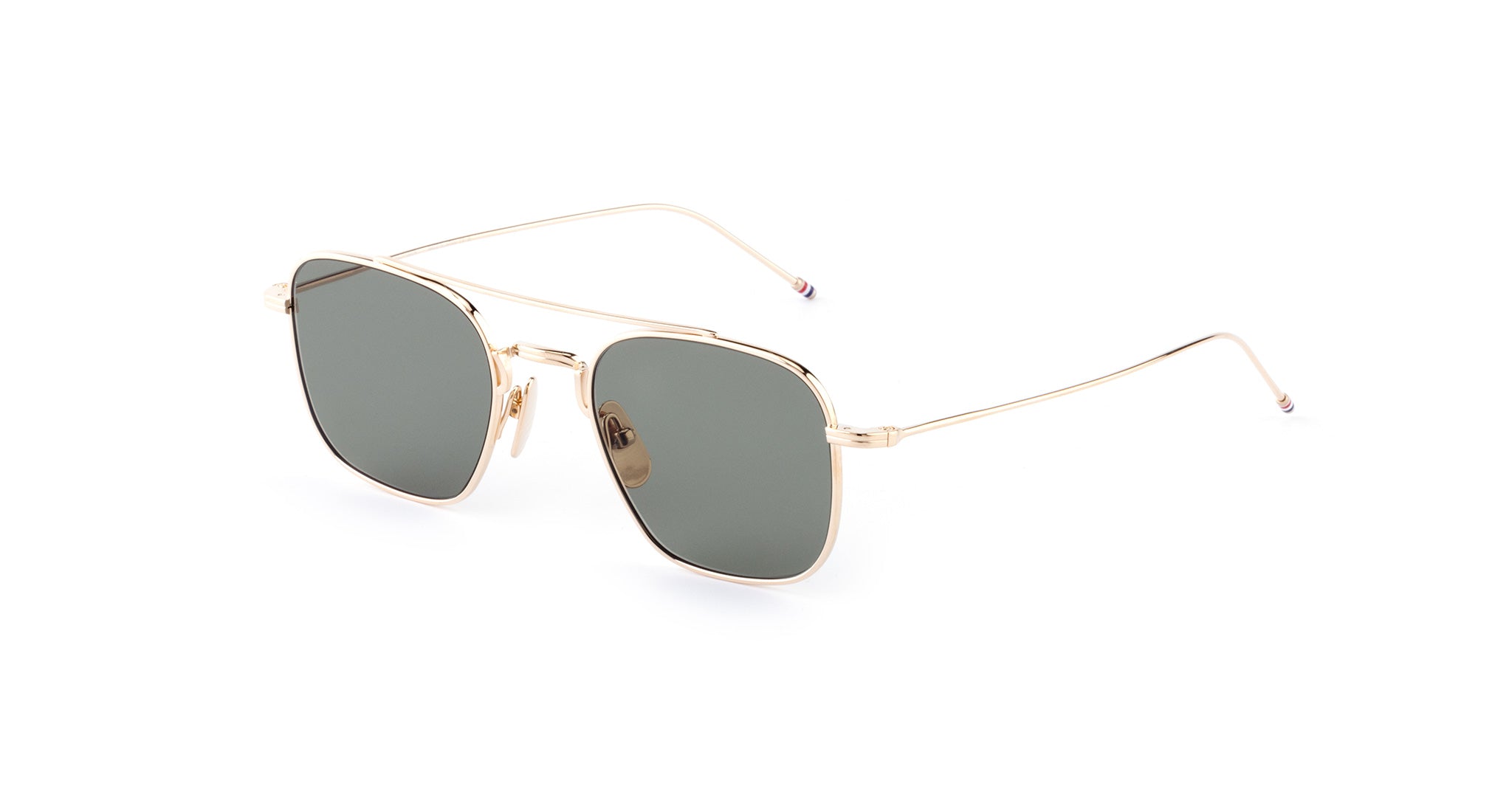 Thom Browne 907 sunglasses with gold aviator frame, square dark lenses, and thin temples, front angle view.