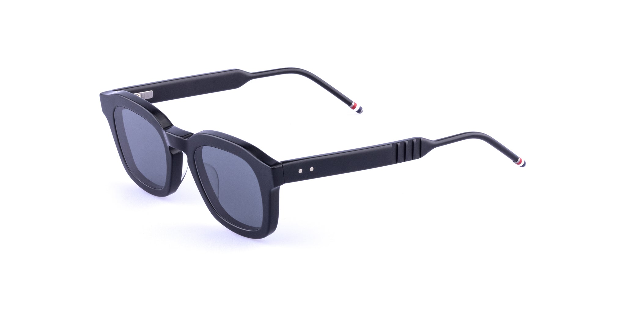 Thom Browne 412 black rectangular sunglasses with dark lenses and striped tips, front angle view.