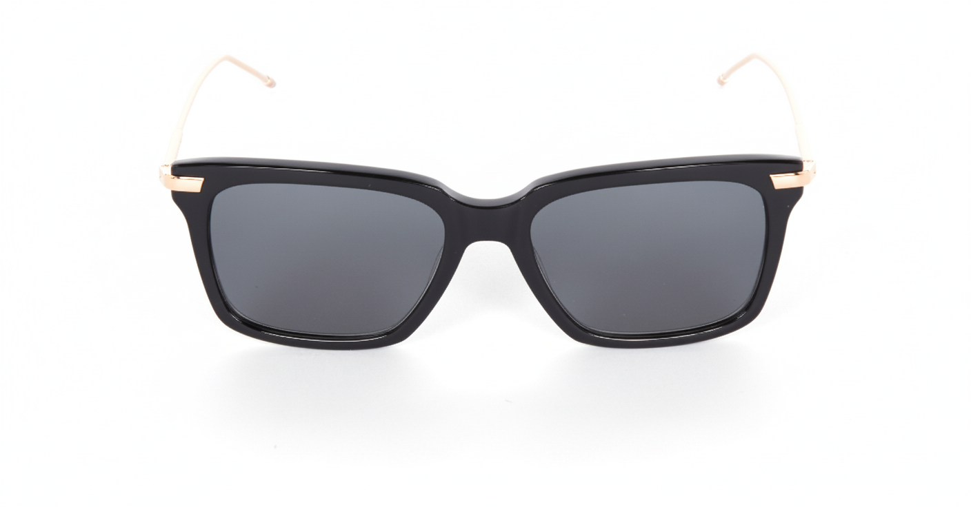 Thom Browne 701 sunglasses, front angle: black rectangular frames, dark lenses, thin gold arms. Brand: Thom Browne.