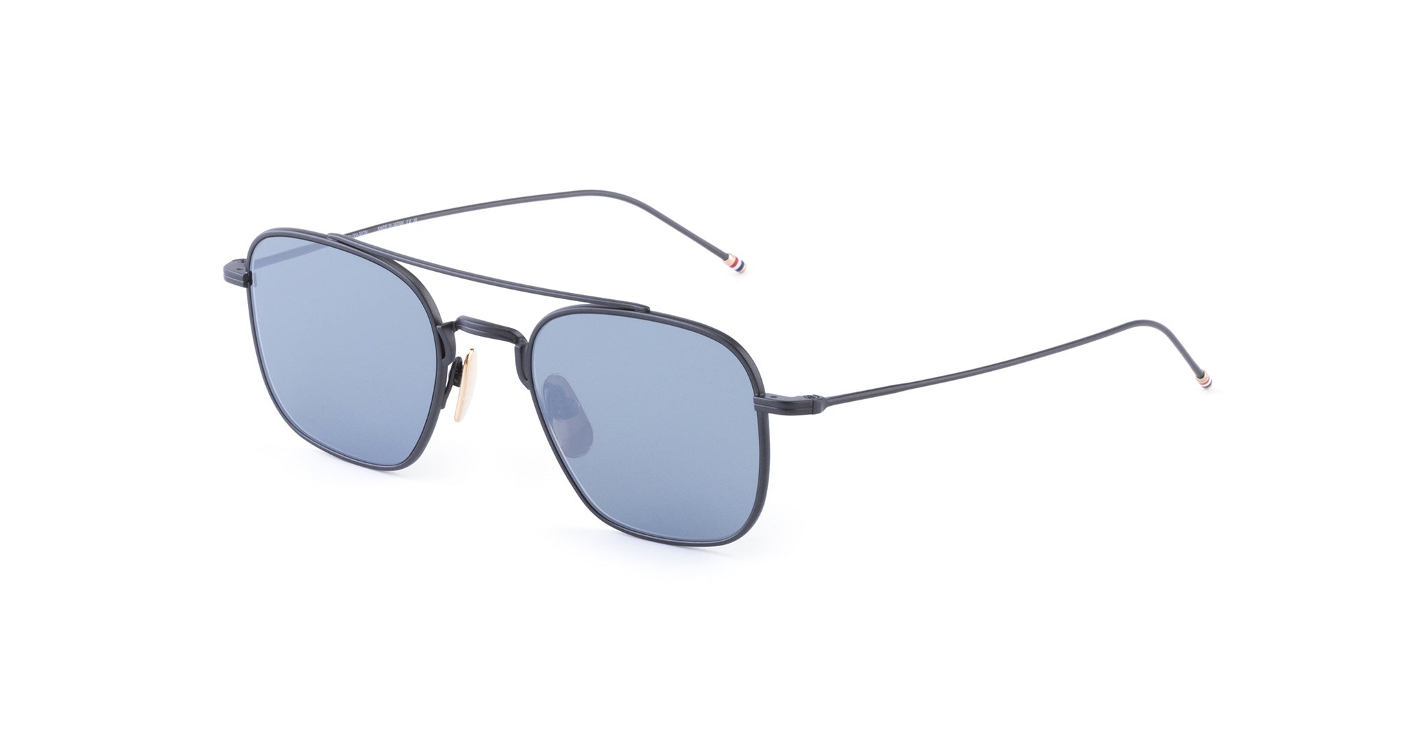 COMING SOON Thom Browne 907 sunglasses feature a sleek, square design with thin black metal frames and dark blue lenses, displayed on a white background.