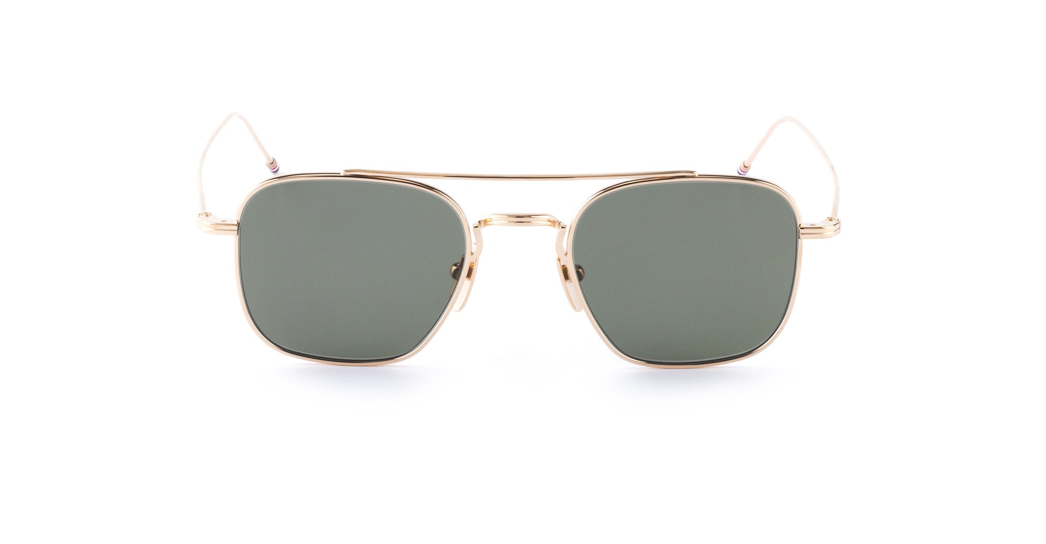 Thom Browne 907 square gold sunglasses with green lenses, thin temples, and double bridge shown from a front angle.