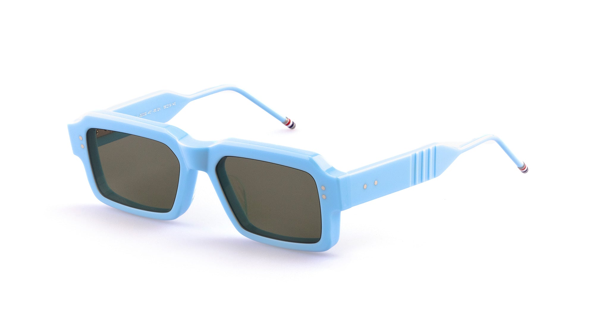 A pair of Thom Browne 924 sunglasses with thick, light blue square frames and dark lenses, displayed on a white background. The arms of the glasses have a slight curve and subtle decorative lines.
