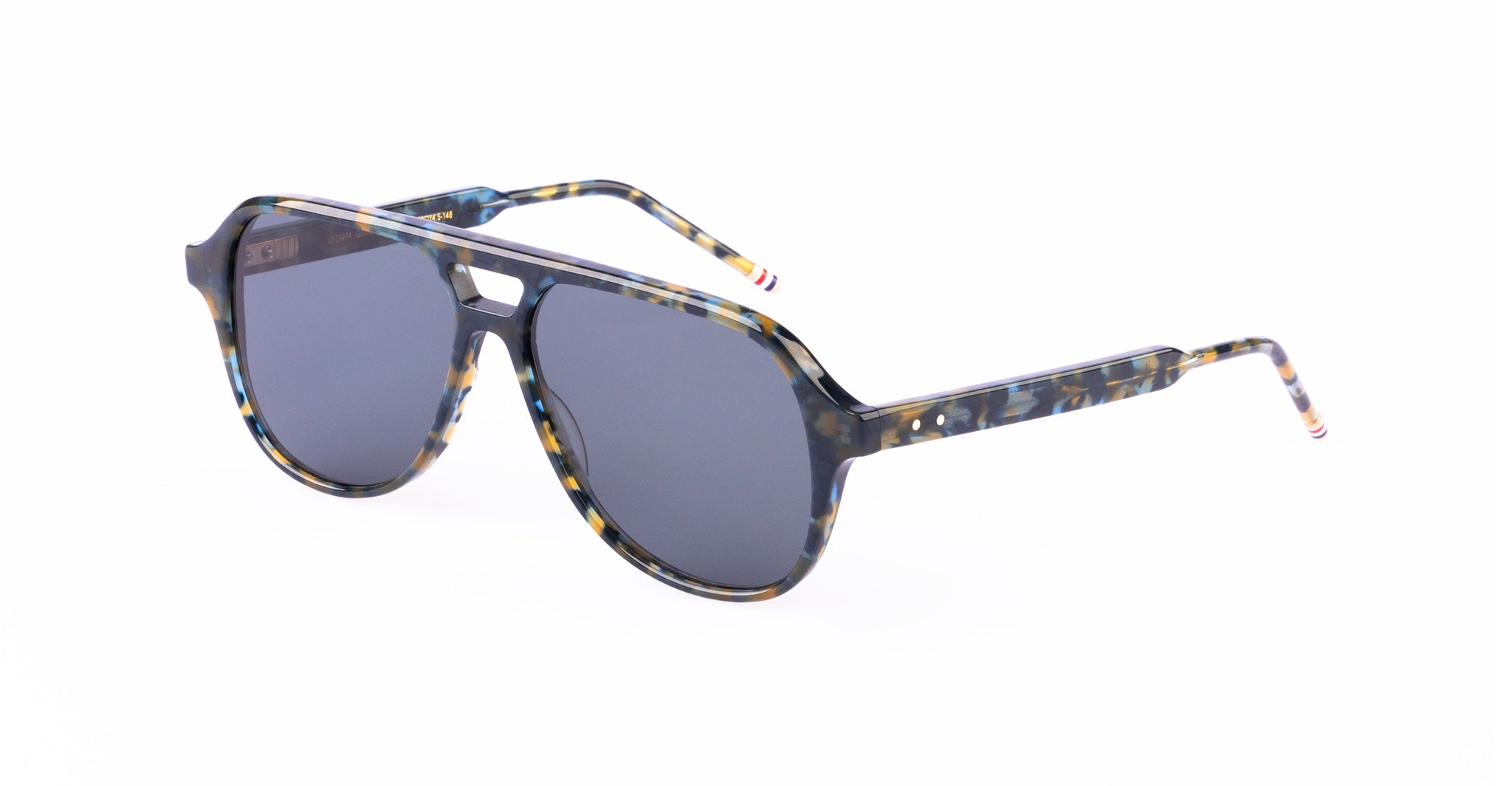 A pair of sunglasses with dark lenses and a blue and yellow tortoiseshell-patterned frame, shown on a white background. The temples have small red, white, and blue striped accents at the tips.