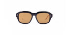 A pair of Thom Browne 928 sunglasses with thick, black geometric navy frames and brown-tinted lenses is shown against a plain white background.