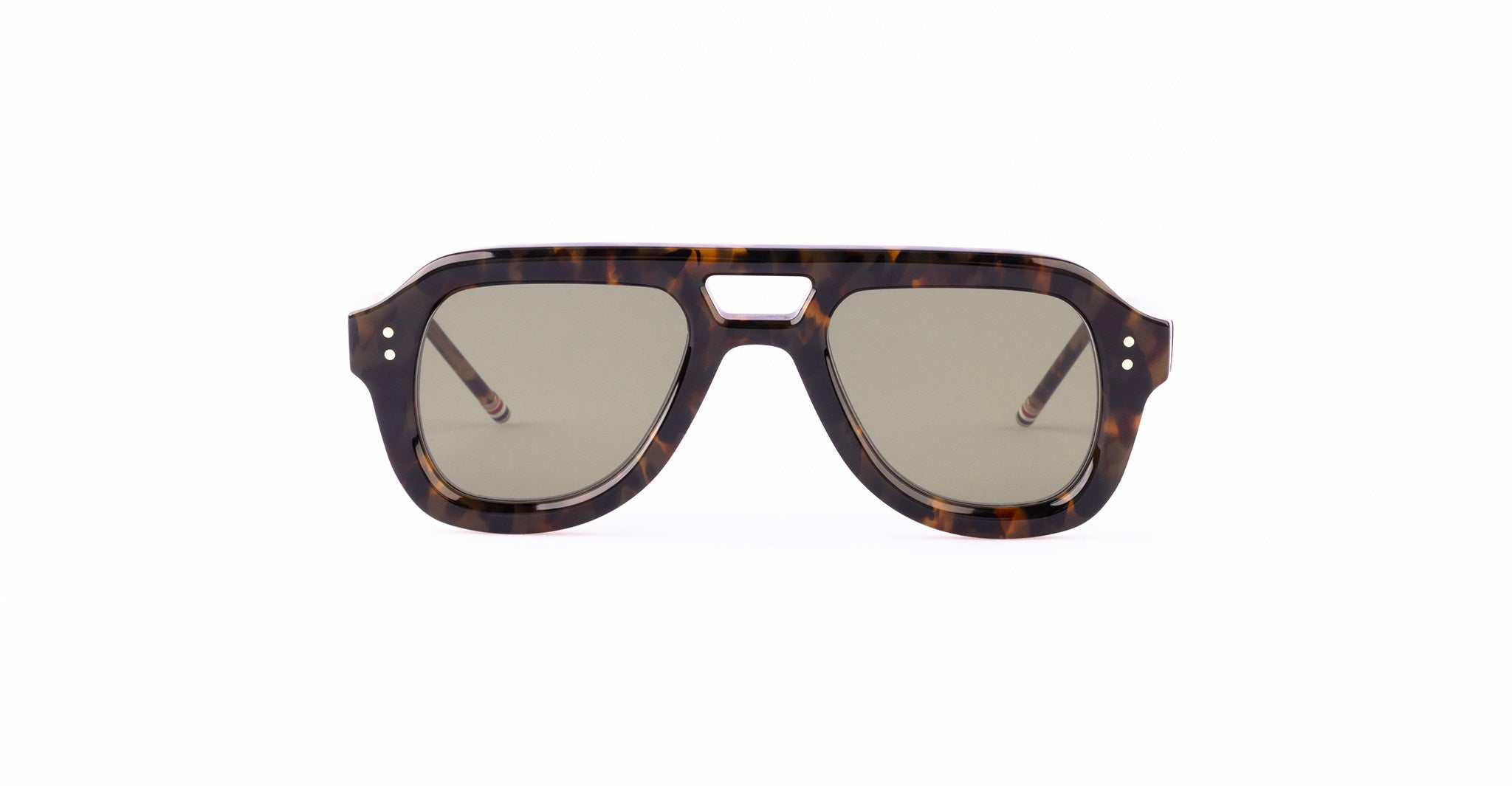 A pair of Thom Browne aviator sunglasses with a tortoiseshell-patterned frame and green-tinted lenses, shown facing forward.