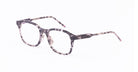 Thom Browne 934 eyeglasses with clear tortoiseshell rectangular frames and thin patterned arms, shown from a side angle.