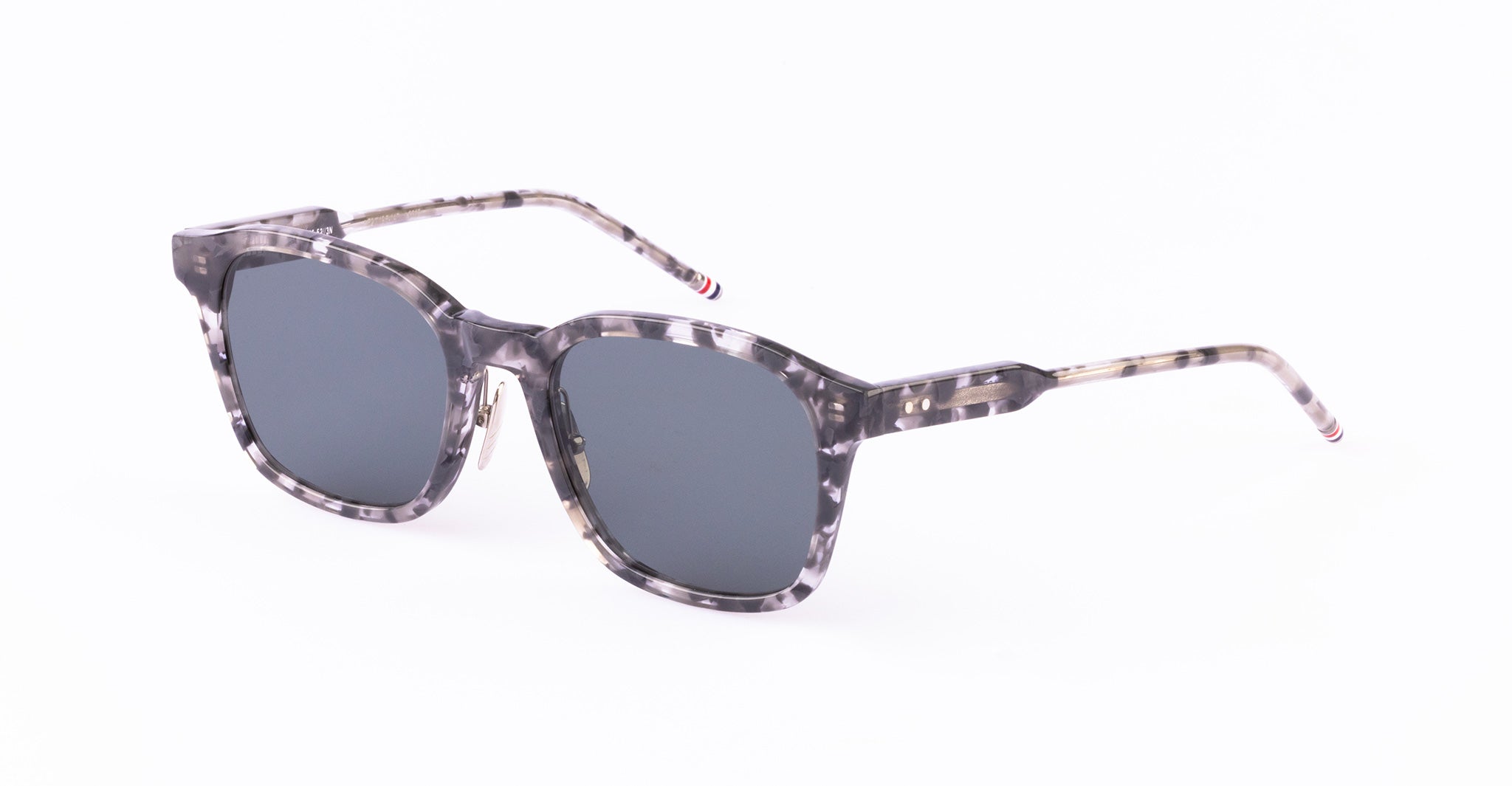 Thom Browne 934 square sunglasses in gray tortoiseshell with dark UV-protective lenses, front view.