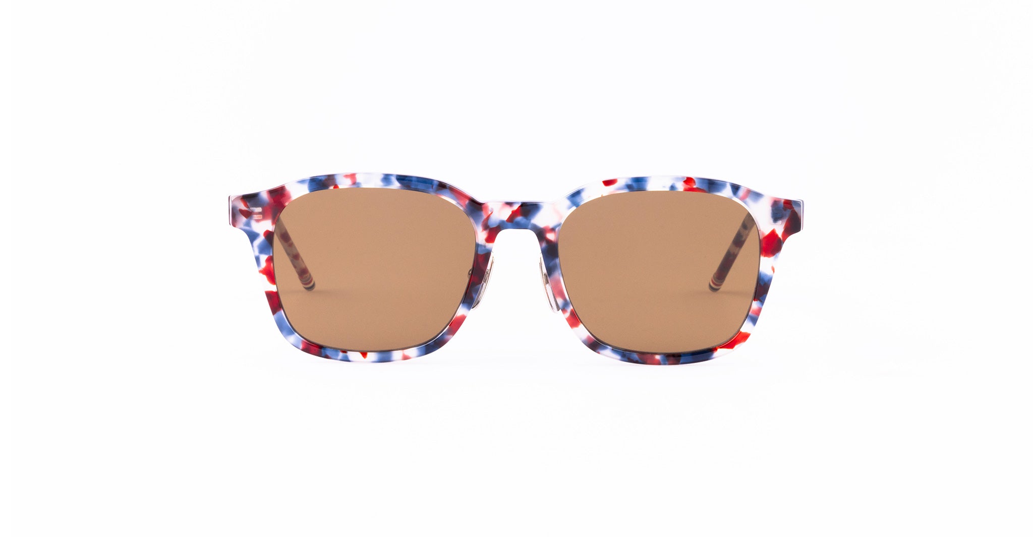 A pair of sunglasses with brown lenses and a multicolored frame featuring red, blue, and white patterns, displayed against a plain white background.